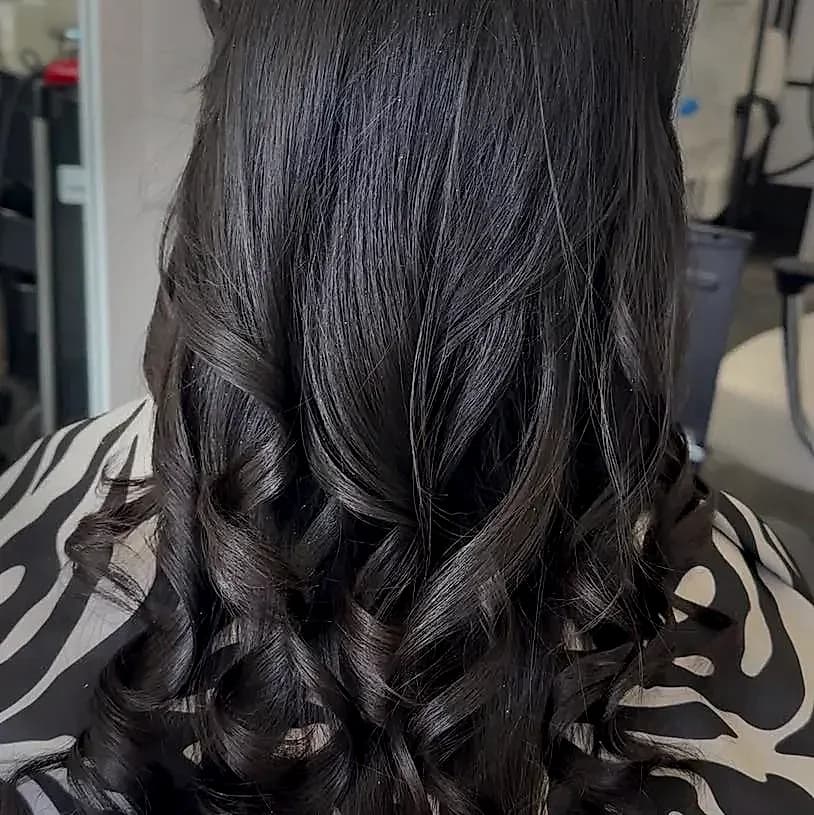 Beautifully styled bouncy curls at Stylin'Chic salon